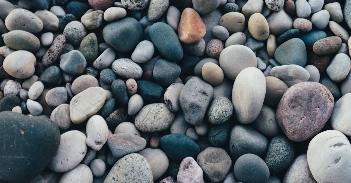A detailed view of smooth, multicolored pebbles creating a natural texture and pattern.